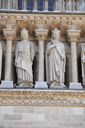 paris cathedral notre dame facade statue close upの写真素材
