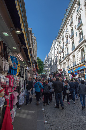 PARIS, FRANCE - MAY 1 2016 - Montmartre street is crowded of french people toruists on sunday sunny day of labour international celebrationのeditorial素材