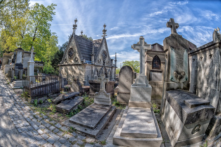 PARIS, FRANCE - MAY 2, 2016: Monumental  Pere-Lachaise cemetery, Paris. Each year thousands fans and...