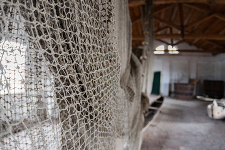 handmade old fishing net inside fishermen house detail in Comacchio unsesco protected areaの写真素材