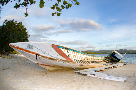 wooden ship wreck on the beach at susnetの写真素材