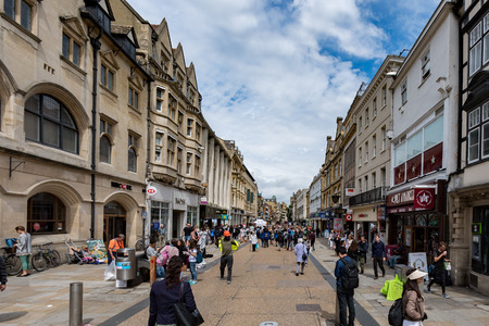OXFORD, ENGLAND - JULY 15 2017 - Tourist in well famous town streets coming from asia, europe and america. Oxford is the ancient university town one of most viisted in England and in the world.のeditorial素材
