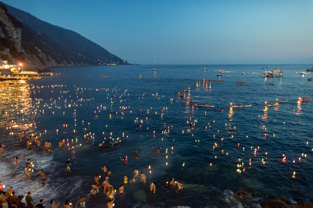 CAMOGLI, ITALY - AUGUST 6 2017 -  The traditional celebration that Camogli inhabitants dedicate to the Holy Virgin, worshipped with the title of "Star of the Sea". During the night when thousands of tiny lit candles are left bobbing on the water from the のeditorial素材