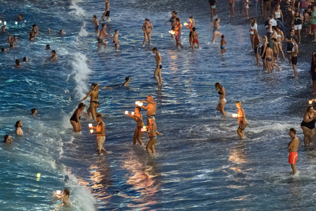 CAMOGLI, ITALY - AUGUST 6 2017 -  The traditional celebration that Camogli inhabitants dedicate to the Holy Virgin, worshipped with the title of "Star of the Sea". During the night when thousands of tiny lit candles are left bobbing on the water from the のeditorial素材