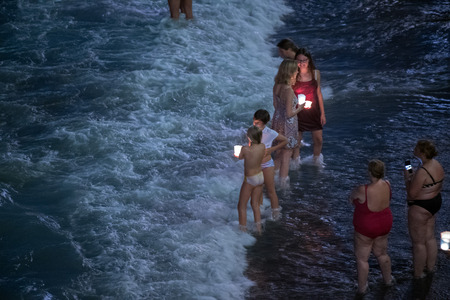 CAMOGLI, ITALY - AUGUST 6 2017 -  The traditional celebration that Camogli inhabitants dedicate to the Holy Virgin, worshipped with the title of "Star of the Sea". During the night when thousands of tiny lit candles are left bobbing on the water from the のeditorial素材