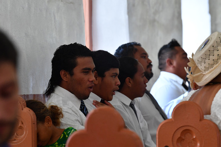 AITUTAKI, COOK ISLAND - AUGUST, 27 2017 - Local people at the christian mass wearing traditional colorful polynesian dressのeditorial素材