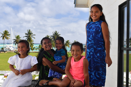 AITUTAKI, COOK ISLAND - AUGUST, 27 2017 - Local people at the christian mass wearing traditional colorful polynesian dressのeditorial素材