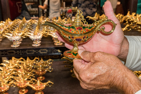man hands rubbing on alladin lampの写真素材