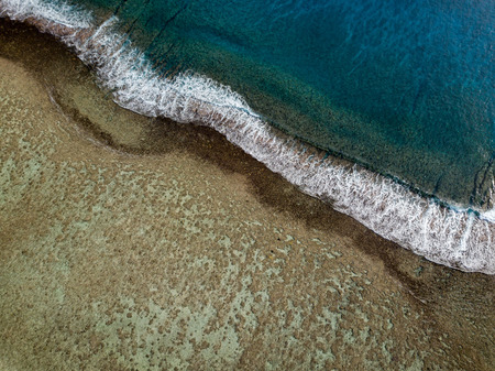 Waves on reef of Rarotonga Polynesia Cook Islands aerial landscape