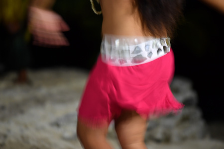 Polynesia dance hula move effect at nightの写真素材