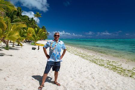 happy smiling man on tropical beach of polynesia
