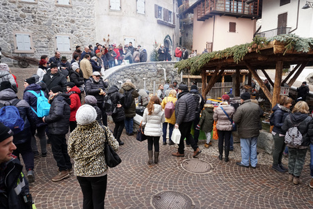 RANGO, ITALY - DECEMBER 1, 2017 - People buying at the shops of traditional christmas market in the beautiful medieval villageのeditorial素材