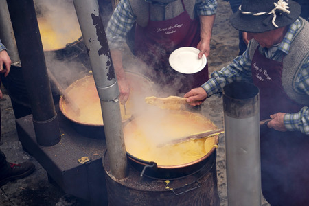 RANGO, ITALY - DECEMBER 1, 2017 - People buying at the shops of traditional christmas market in the beautiful medieval villageのeditorial素材