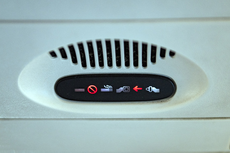 belt on sign on airplane detail
