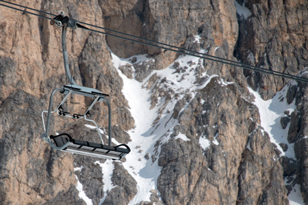 Chair Lift for skiers in winter snow time dolomites backgroundの写真素材