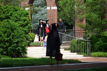 BALTIMORE, USA - MAY 21 2018- it is graduation day at Maryland well famous John Hopkins university. Students celebrate trowing hats in the air.のeditorial素材