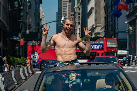 NEW YORK, USA - MAY 25 2018 - young man in a car in Times Square is a major commercial intersection,...