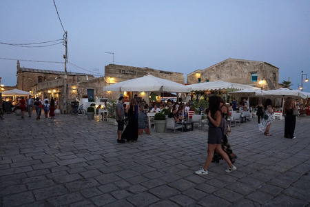 MARZAMEMI, ITALY - JULY 1 2018 - Old fishing village is one of  the most beautiful 20 sea towns of Italy. Tourist from all around the world; restaurant serving tasty fish recipes and wedding in this medieval county.のeditorial素材