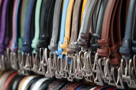 different colors leather belt on display at the market for saleの写真素材