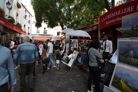 PARIS, FRANCE - OCTOBER 6 2018 - Artist painting and drawing portraits on sunny sunday day in Montmartre Place du Tertre famous artist retreatのeditorial素材