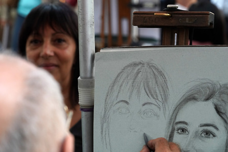 PARIS, FRANCE - OCTOBER 6 2018 - Artist painting and drawing portraits on sunny sunday day in Montmartre Place du Tertre famous artist retreatのeditorial素材