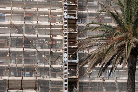 scaffolding on building restoration in Genoa, Italy