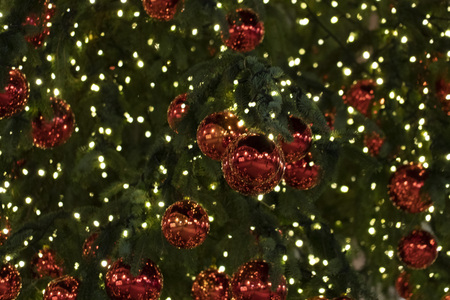 street christmas tree decorations and lights red xmas ballsの写真素材