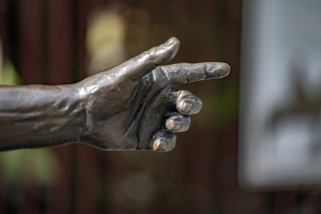 left hand finger pointing indicating copperの写真素材