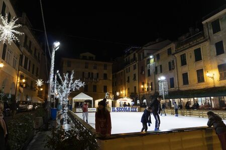 CHIAVARI, ITALY - DECEMBER 23, 2018 - Historical medieval town place is now open for ice skating for christmas.のeditorial素材
