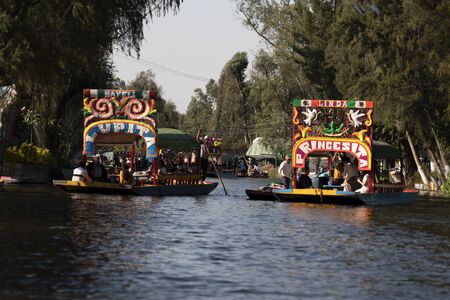 MEXICO CITY, MEXICO - JANUARY 30 2019 - Xochimilco the mexican little venice attract tourists and other city residents to ride on colorful gondola-like boats around the 170 km of canalsのeditorial素材