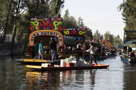 MEXICO CITY, MEXICO - JANUARY 30 2019 - Xochimilco the mexican little venice attract tourists and other city residents to ride on colorful gondola-like boats around the 170 km of canalsのeditorial素材