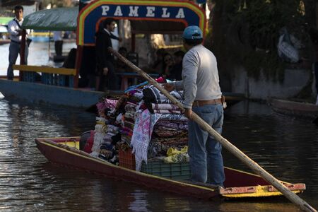 MEXICO CITY, MEXICO - JANUARY 30 2019 - Xochimilco the mexican little venice attract tourists and other city residents to ride on colorful gondola-like boats around the 170 km of canalsのeditorial素材
