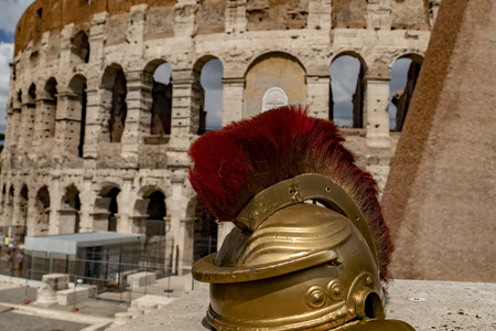 metallic gladiator helmet outside rome coliseum