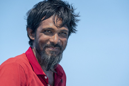 Young maldives man portrait looking at you happy and smiling
