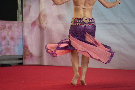 Oriental belly dancer beutiful move detailの写真素材
