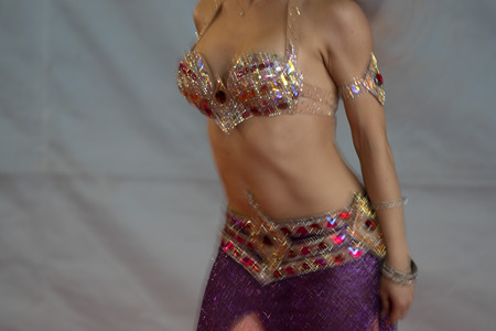 Oriental belly dancer beutiful move detailの写真素材