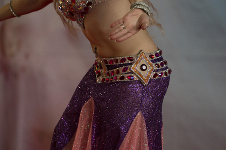 Oriental belly dancer beutiful move detailの写真素材