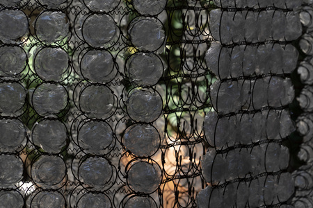 many plastic bottle on metal rusted gridの写真素材