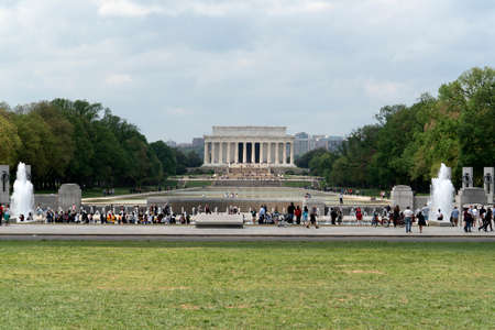 WASHINGTON DC, USA - APRIL 27 2019 - Many tourist at World War II Memorial monument and fountain