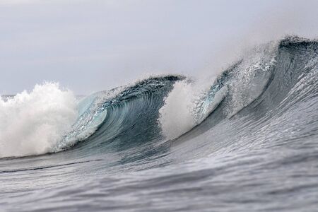 Big Surf wave tube detail  in pacific ocean french polynesia tahitiの写真素材