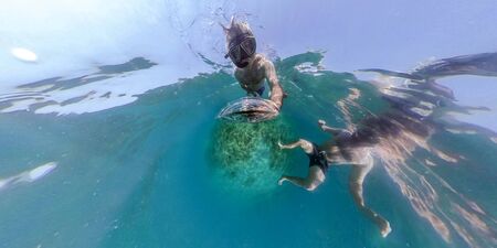 Man while snorkeling in the sea coming to you 360 degrees view landscaoeの写真素材