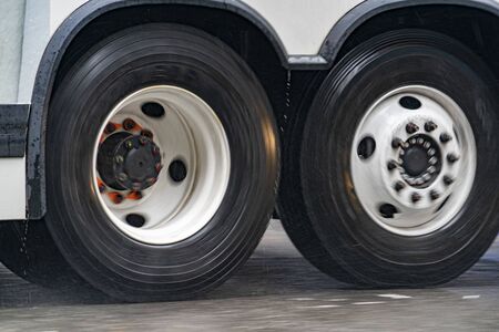 coach bus tire detail while raining in new york city