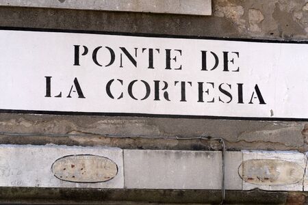 Venice "ponte della cortesia" english translation "courtesy bridge" kindness courtesy bridge signの写真素材