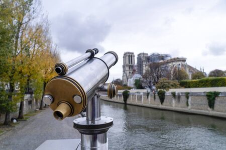 Notre dame paris under restoration from bridge with telescopeの写真素材
