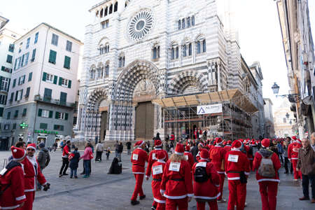 GENOA, ITALY - DECEMBER 22 2019 - Traditional Santa claus walk more than 2,000 people christmas dressed walking in town centerのeditorial素材