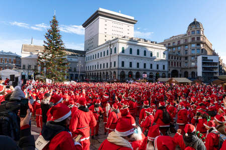 GENOA, ITALY - DECEMBER 22 2019 - Traditional Santa claus walk more than 2,000 people christmas dressed walking in town centerのeditorial素材