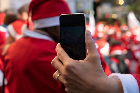 GENOA, ITALY - DECEMBER 22 2019 - Traditional Santa claus walk more than 2,000 people christmas dressed walking in town centerのeditorial素材