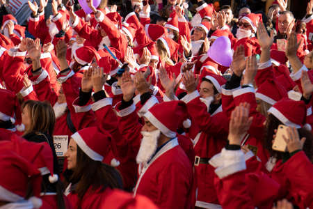 GENOA, ITALY - DECEMBER 22 2019 - Traditional Santa claus walk more than 2,000 people christmas dressed walking in town centerのeditorial素材