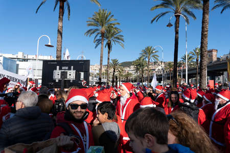 GENOA, ITALY - DECEMBER 22 2019 - Traditional Santa claus walk more than 2,000 people christmas dressed walking in town centerのeditorial素材