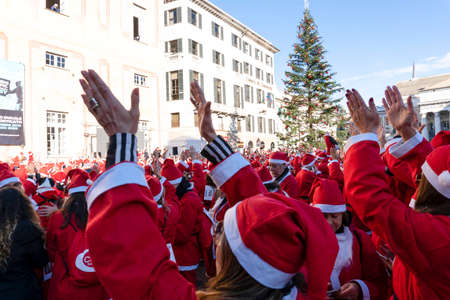 GENOA, ITALY - DECEMBER 22 2019 - Traditional Santa claus walk more than 2,000 people christmas dressed walking in town centerのeditorial素材
